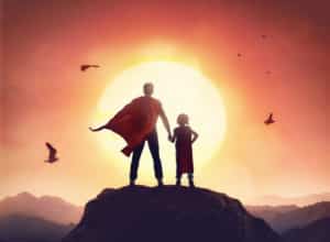 Father and daughter playing superheroes